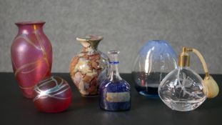 A collection of art glass, including two iridescent pieces a cut glass atomiser and other signed art
