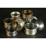 A collection of nine 19th and 20th century silver napkin rings. Various designs, makers and assay