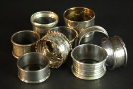 A collection of nine 19th and 20th century silver napkin rings. Various designs, makers and assay