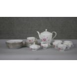 A six person Schumann Bavarian fine china floral design tea set. Makers mark to the base. (21