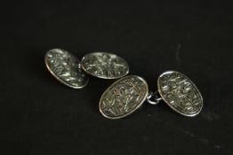 A boxed pair of Victorian silver engraved ivy leaf design chain link cufflinks. Hallmarked: