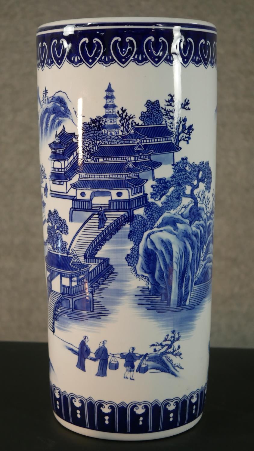A 20th century blue and white Chinese porcelain stick stand decorated with a mountain landscape, - Image 2 of 9