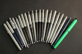 A collection of twenty one vintage ball point pens, including Parker and other makers. (21)