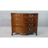 A George III style mahogany serpentine chest, the top crossbanded in satin birch, on four long