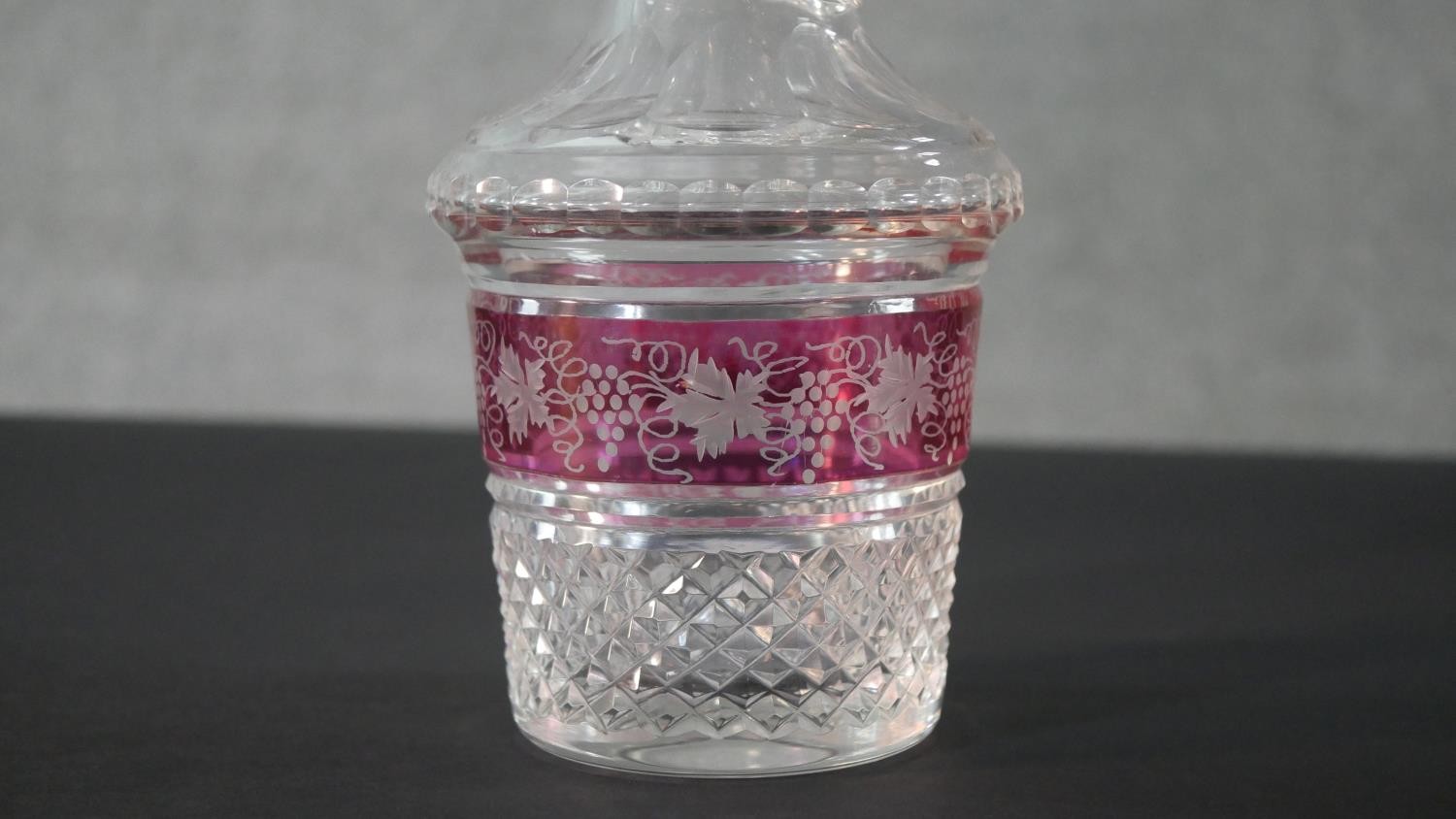 A pair of early 20th century Bohemian cut crystal decanters with painted ruby central bands engraved - Image 3 of 10