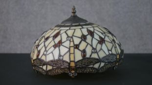 A Tiffany style leaded glass table lamp shade, decorated with dragonflies. H.20 W.31cm