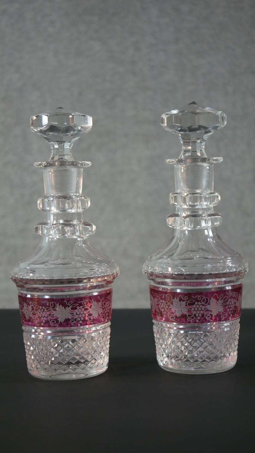 A pair of early 20th century Bohemian cut crystal decanters with painted ruby central bands engraved - Image 2 of 10