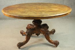 Dining table, late 19th century burr walnut with tilt top action on carved base. H.73 W.136 D.130cm.