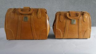 Two tan leather Gladstone style doctors bags with brass hardware. H.33 W.40cm (largest)