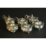 Six sterling silver hinged lid mustard pots, various designs, makers and assay marks. Weight.376g.