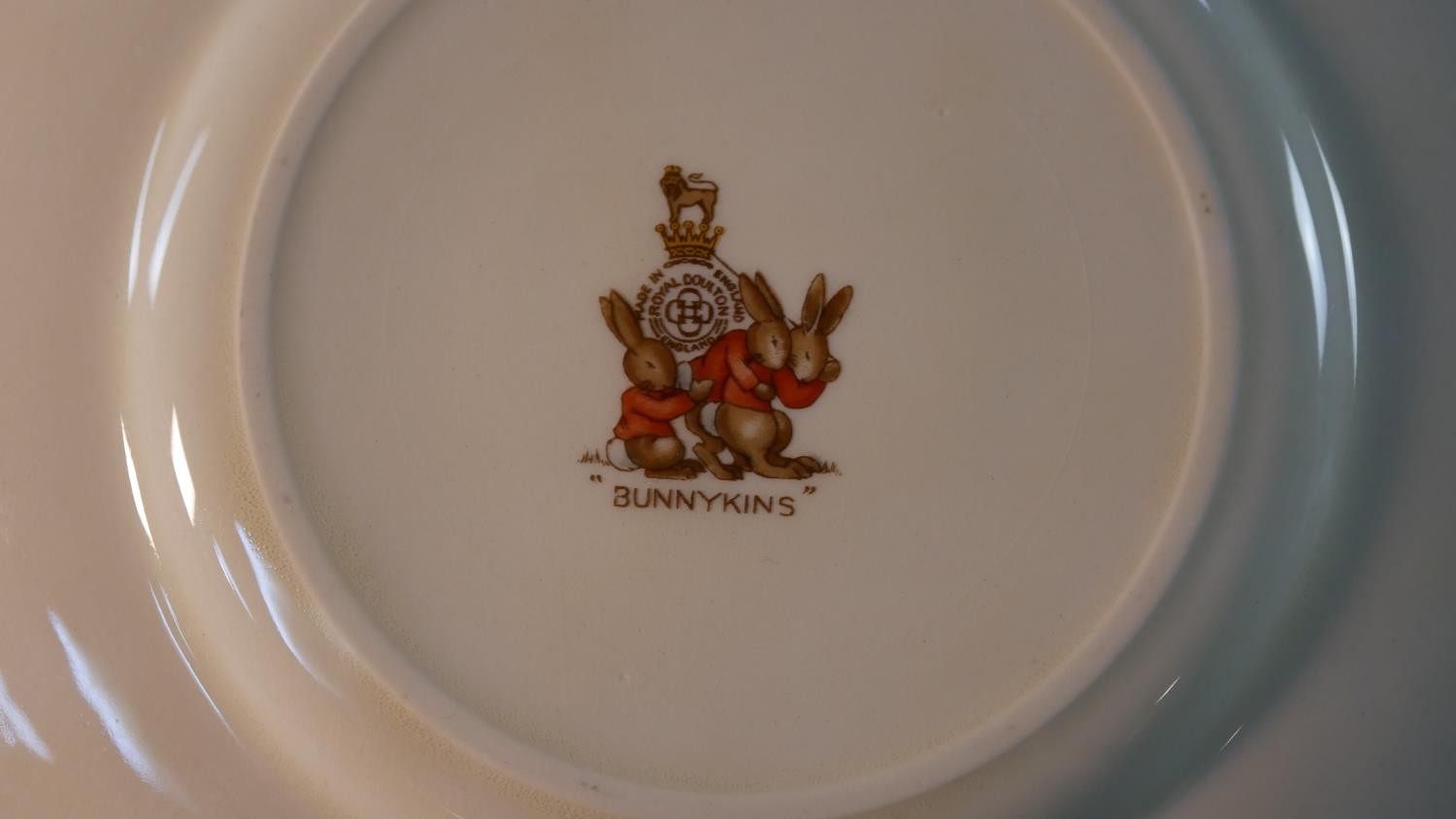 A collection of Royal Doulton Bunnykins pattern child's crockery, includes three cups, a moneybox, a - Image 9 of 16