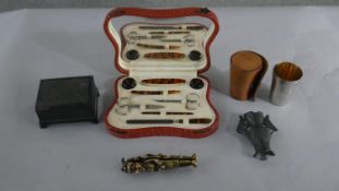 A collection of collectables, including a vintage vanity set, a brass Punch and Judy nutcracker, a