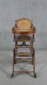 A late 19th century carved beech child's high chair converting to baby walker. H.87 W.39 D.61cm