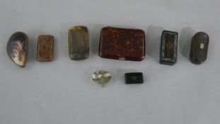 A collection of eight early 20th century snuff boxes, including a purple mussel shell box, a burr