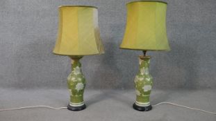 A pair of Japanese gilded and hand painted Chrysanthemum design vases turned lamps on ebonised