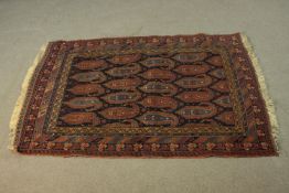 A Persian Kurdish blue ground hand made rug. L.132 W.102cm.