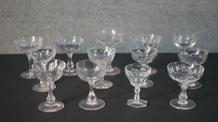 A collection of thirteen 19th and early 20th century bowl shaped champagne coupes and cordial