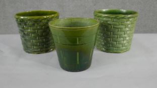 A collection of three various size 19th century Bretby pottery green glaze planters with different