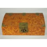 A burr walnut veneer Chinese style jewellery box with brass fittings with padlock (no key), paper