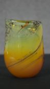 A signed art glass vase with orange to green gradient. Signed to base. H.15 W.11 D.7cm