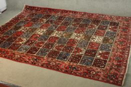 A Persian Kashan red ground hand made carpet. L.310 W.210cm.