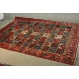 A Persian Kashan red ground hand made carpet. L.310 W.210cm.