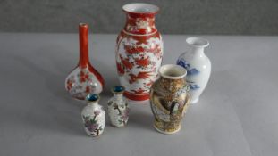 A collection of Oriental vases, including a pair of cloisonné enamel vases, a blue and white