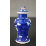 An Chinese blue and white hand painted prunus blossom design ceramic lidded vase. H.13.5 Diam.6cm