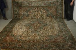 A Indian silk Kashmir cream ground hand made carpet. L.335 W.245cm.