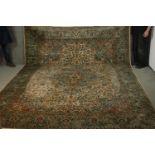 A Indian silk Kashmir cream ground hand made carpet. L.335 W.245cm.