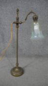 A late Victorian brass adjustable desk lamp, with an etched opalescent Vaseline glass shade, on a