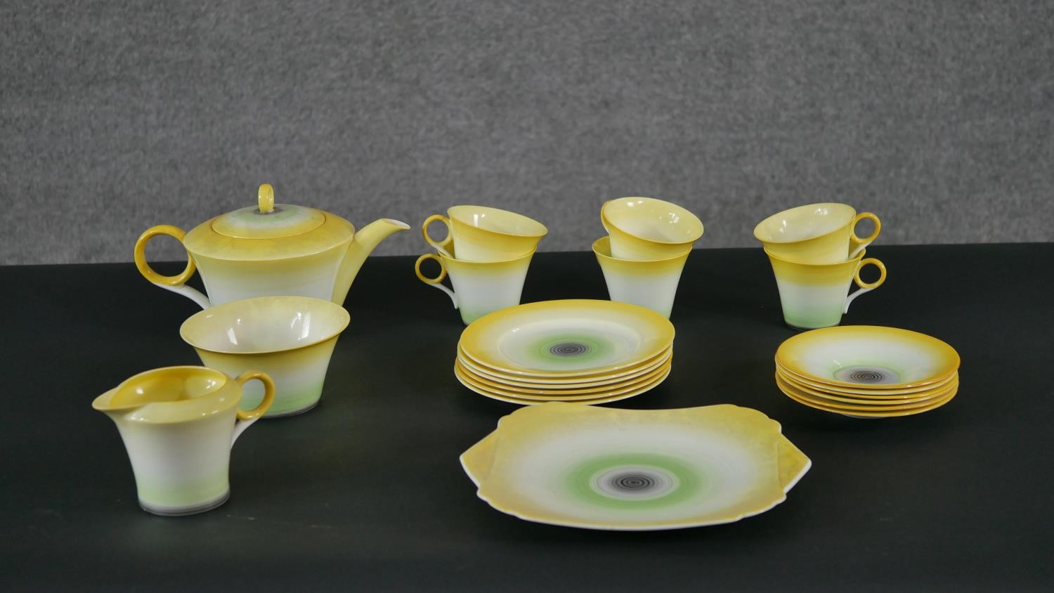An Art Deco Shelly hand painted green and yellow porcelain tea set for six people. Makers mark to