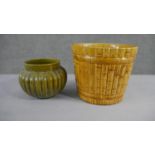 A collection of two various size 19th century pottery honey glaze planters with different designs,