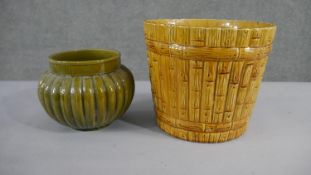 A collection of two various size 19th century pottery honey glaze planters with different designs,