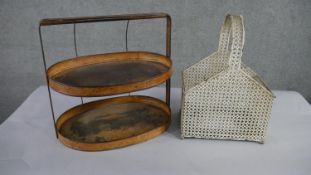 A 19th century painted metal two tired kitchen tray along with a cream painted pierced iron