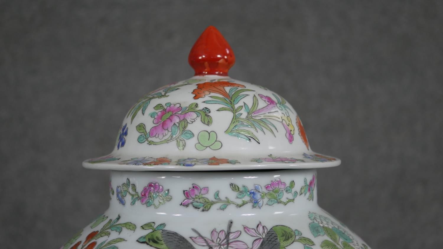 A large Chinese hand painted porcelain Famille Rose lidded jar, decorated with flowers, insects - Image 2 of 12