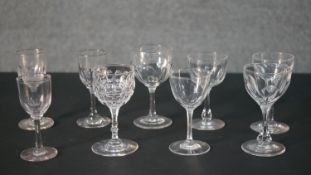 A collection of nine 19th and early 20th century petal faceted glass stemmed drinking glasses,
