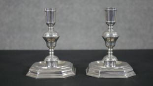 A pair of John Somers pewter candle sticks with octagonal bases. Marked to base. H.15 W.11 D.11cm
