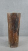 A stick stand made from a hollowed out hardwood tree trunk. H.117 W.51cm