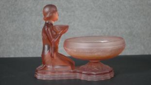 An Art Deco pink moulded glass Lalique style posy bowl and stand of a kneeling female figure with