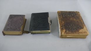 Three Victorian embossed leather photo albums, two with brass locks. H.22 W.18cm (largest)