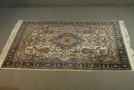 An Indian part silk Agra cream ground hand made rug. L.190 W.124cm.