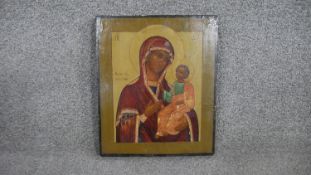 A 19th century hand painted Russian icon on panel, The Virgin Hodigitria. H.31.5 W.6 W.2.5cm