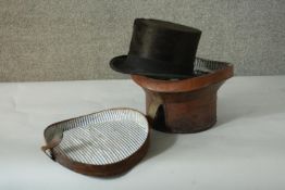 A brown leather cased Edwardian gentleman's black moleskin silk top hat - retailer R W Forsyth,