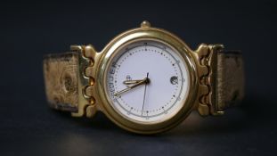 An 18 carat yellow gold ‘Tigresse’ watch, by Fred. Date and days of week aperture, white dial,