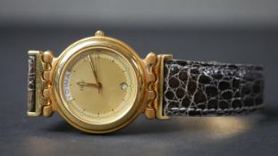 An 18 carat yellow gold ‘Tigresse’ watch, by Fred. Date and days of week aperture, gilt dial and