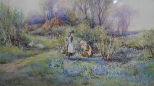 Emily Stannard (British 1875-1907), picking flowers in a garden, watercolour, signed lower left.H.43
