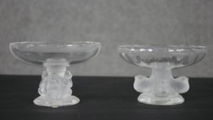 A pair of Lalique glass tazza with frosted sculpted bases, one supported by four birds, the other by