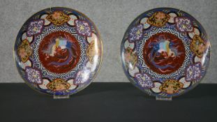 A pair of 19th century Japanese cloisonné enamel phoenix plates, with colourful geometric