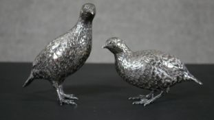 A pair of silver engraved partridges, hallmarked: PM, deer head, date letter and signed PM. Gross